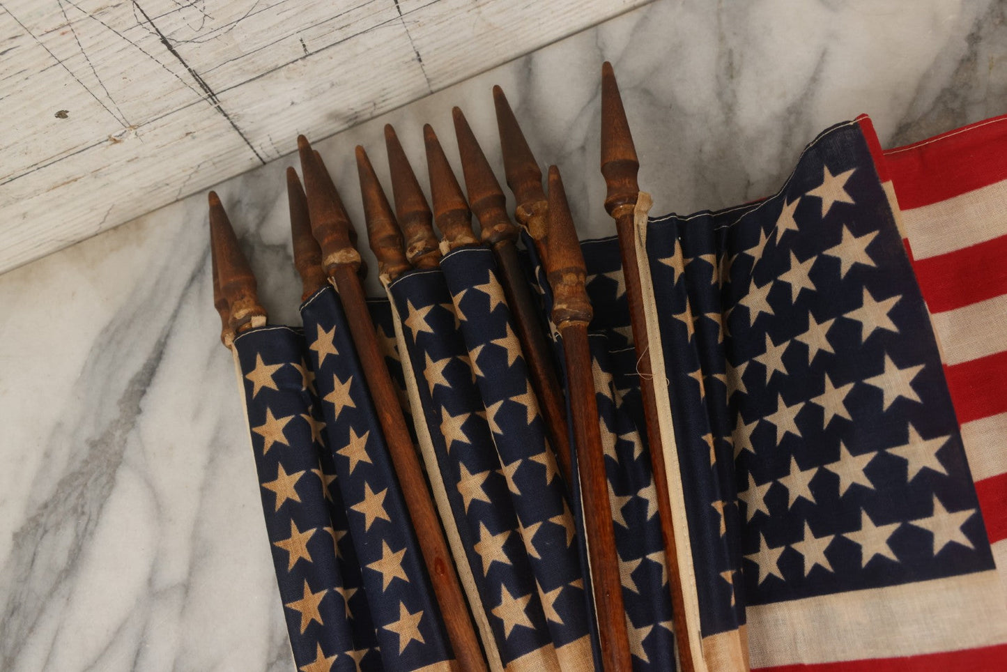 Lot 036 - Bundle Of Twelve Vintage 48-Star Hand-Held Parade Flags On Wooden Poles With Finials, Poles 32-1/2" L Each