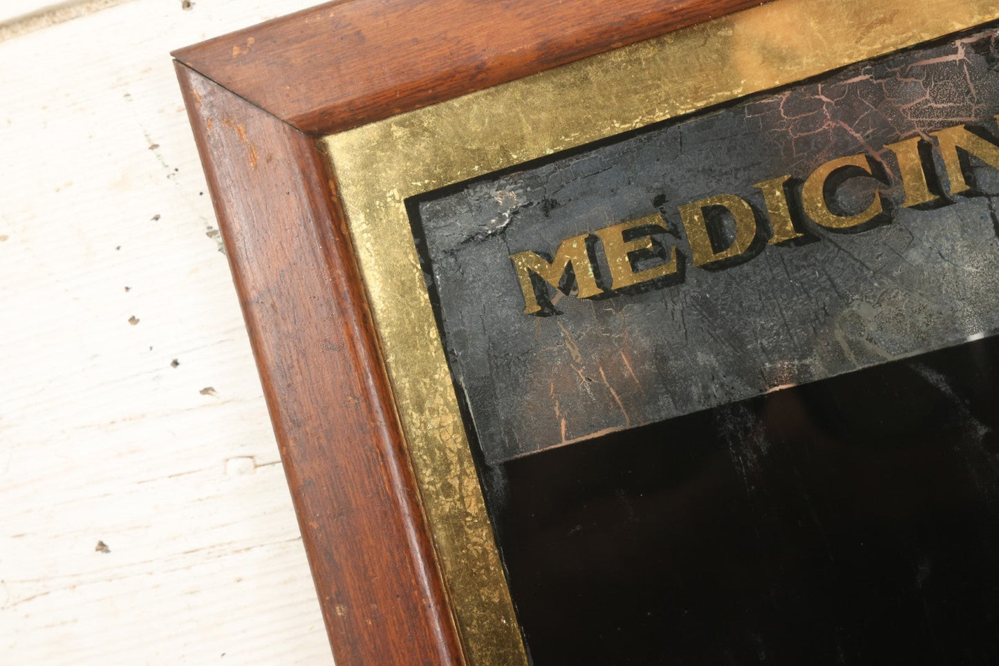 Lot 038 - Antique Reverse-Painted Glass Sign Panel Reading "Medicines." With Black Display Field And Gold Leaf Border, Possibly For Apothecary Or Doctor's Office, Framed, 14-1/4" x 19-1/4"