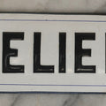 Lot 039 - Antique Convex Porcelain Sign “Ateliers” ( French, "Workshops") With Black Letters On White Field And Navy Blue Pinstripes, Marked "Busath-Brux," Édouard Busath, Brussels, Belgium, 9-7/8" x 2-3/4"