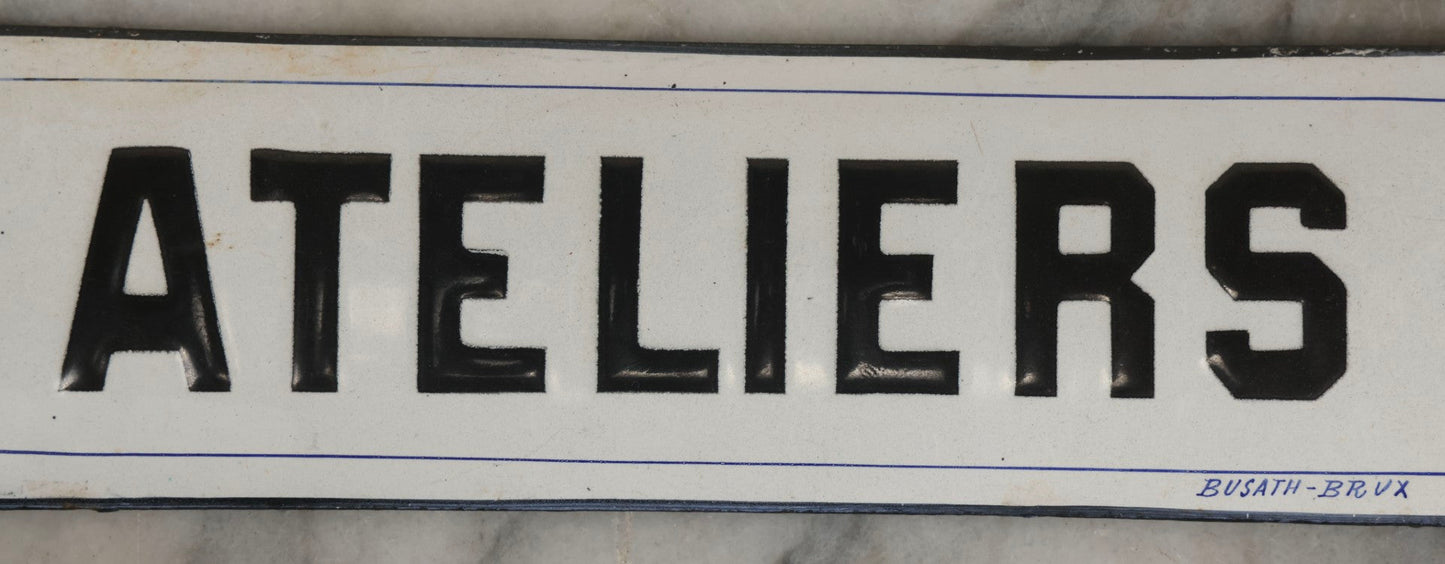 Lot 039 - Antique Convex Porcelain Sign “Ateliers” ( French, "Workshops") With Black Letters On White Field And Navy Blue Pinstripes, Marked "Busath-Brux," Édouard Busath, Brussels, Belgium, 9-7/8" x 2-3/4"