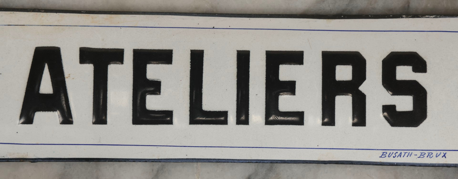 Lot 039 - Antique Convex Porcelain Sign “Ateliers” ( French, "Workshops") With Black Letters On White Field And Navy Blue Pinstripes, Marked "Busath-Brux," Édouard Busath, Brussels, Belgium, 9-7/8" x 2-3/4"