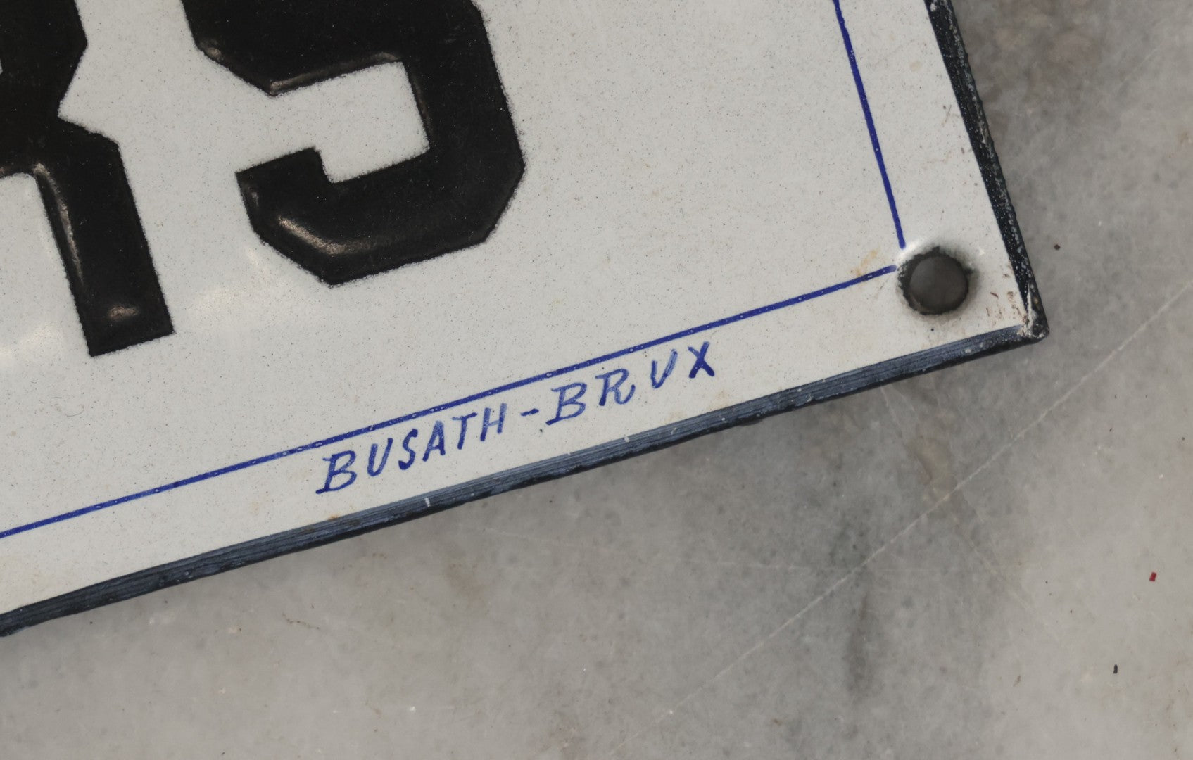 Lot 039 - Antique Convex Porcelain Sign “Ateliers” ( French, "Workshops") With Black Letters On White Field And Navy Blue Pinstripes, Marked "Busath-Brux," Édouard Busath, Brussels, Belgium, 9-7/8" x 2-3/4"