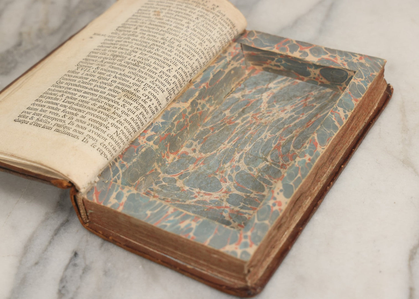 Lot 043 - Antique Hollowed Book Safe Made From “Traittez Sur La Prière Publique” (“Treatise On Public Prayer”), Bruxelles, 1707, By Eugene Henry Fricx, With French “P-V” Maker's Stamp