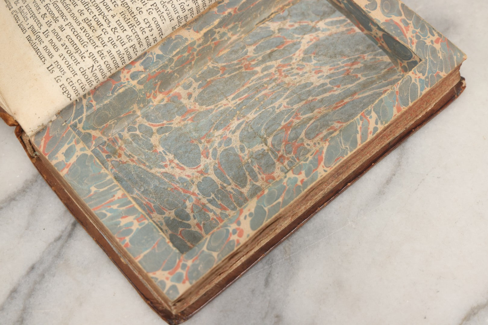 Lot 043 - Antique Hollowed Book Safe Made From “Traittez Sur La Prière Publique” (“Treatise On Public Prayer”), Bruxelles, 1707, By Eugene Henry Fricx, With French “P-V” Maker's Stamp