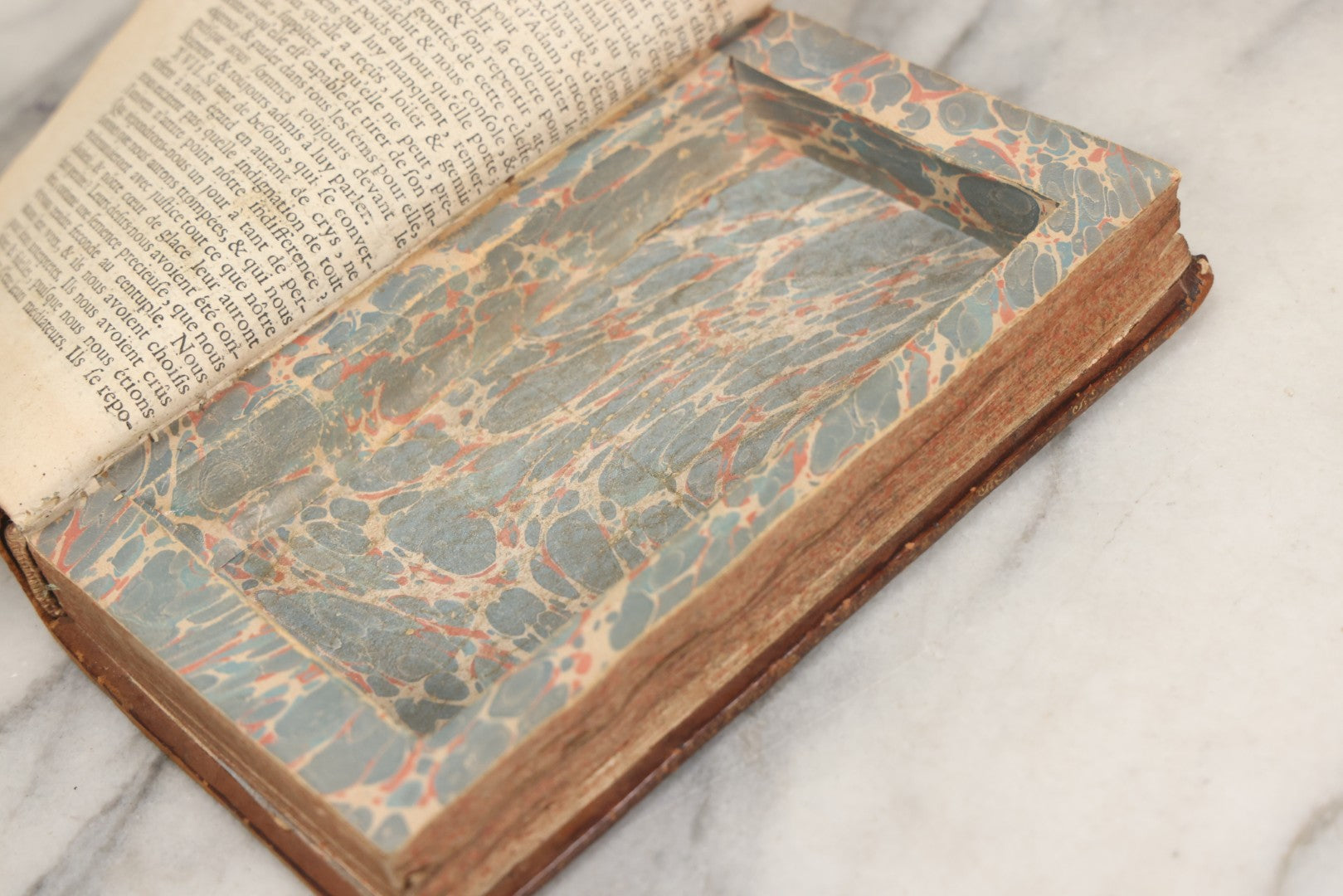 Lot 043 - Antique Hollowed Book Safe Made From “Traittez Sur La Prière Publique” (“Treatise On Public Prayer”), Bruxelles, 1707, By Eugene Henry Fricx, With French “P-V” Maker's Stamp