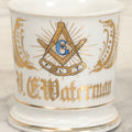 Lot 047 - Antique Hand-Decorated Porcelain Mug With Masonic Compass And Square, All-Seeing Eye, And Odd Fellows Three-Link F.L.T. Emblems, Belonging To V.E. Waterman, With Gold Painted Accents, T&V Limoges, France, 3-5/8" H