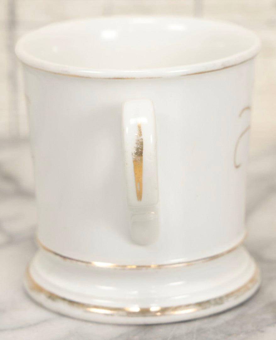 Lot 047 - Antique Hand-Decorated Porcelain Mug With Masonic Compass And Square, All-Seeing Eye, And Odd Fellows Three-Link F.L.T. Emblems, Belonging To V.E. Waterman, With Gold Painted Accents, T&V Limoges, France, 3-5/8" H