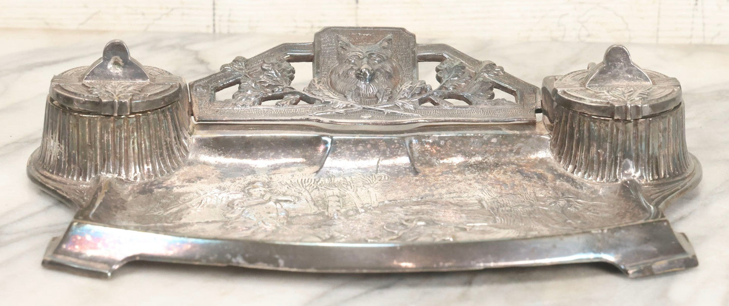 Lot 052 - Antique Cast Iron Double Inkwell With Chrome Finish Depicting Fox Head, Oak Branches, And English Hunting Scene With Hunter, Dog, And Stag, Stamped L.P., Circa Early 20th Century