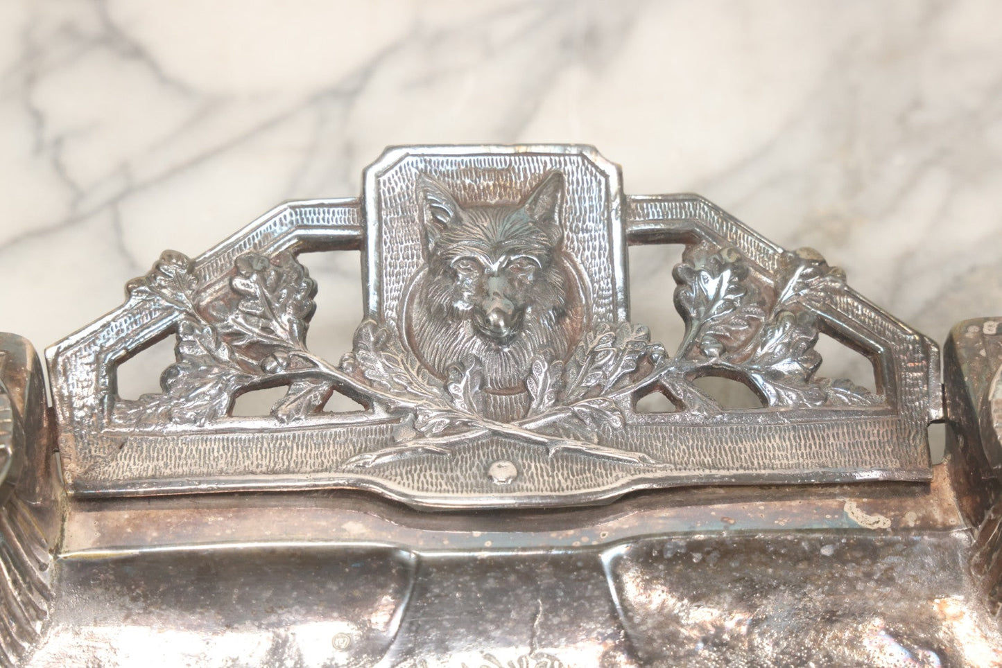 Lot 052 - Antique Cast Iron Double Inkwell With Chrome Finish Depicting Fox Head, Oak Branches, And English Hunting Scene With Hunter, Dog, And Stag, Stamped L.P., Circa Early 20th Century