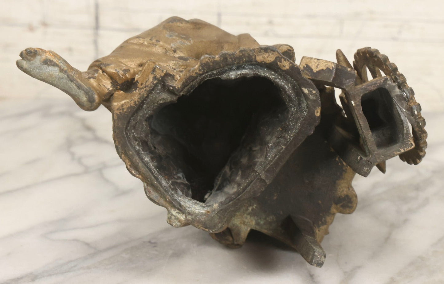 Lot 057 - Antique Cast Spelter Metal Clock Topper Statue With Bronze Wash Depicting Goddess-Like Woman Beside Gear, Anvil, And Blacksmith's Hammer, 8-1/2" H