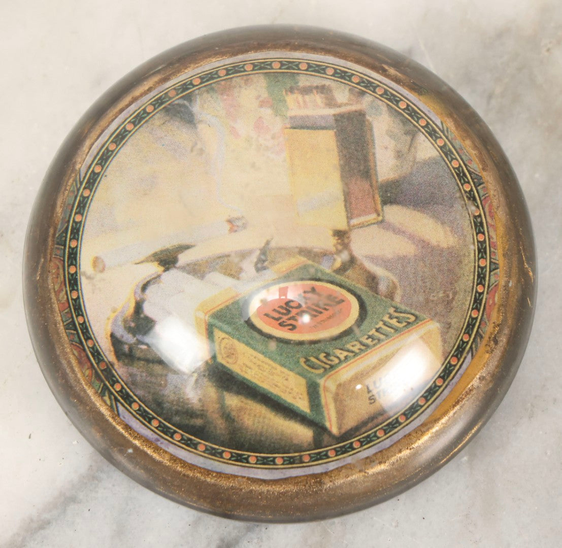 Lot 064 - Vintage Domed Glass Lucky Strike Cigarettes Advertising Paperweight With Box And Smoldering Cigarette In Ashtray