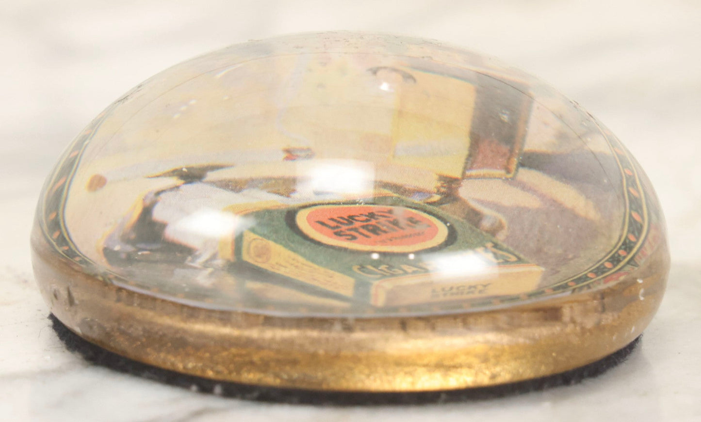 Lot 064 - Vintage Domed Glass Lucky Strike Cigarettes Advertising Paperweight With Box And Smoldering Cigarette In Ashtray