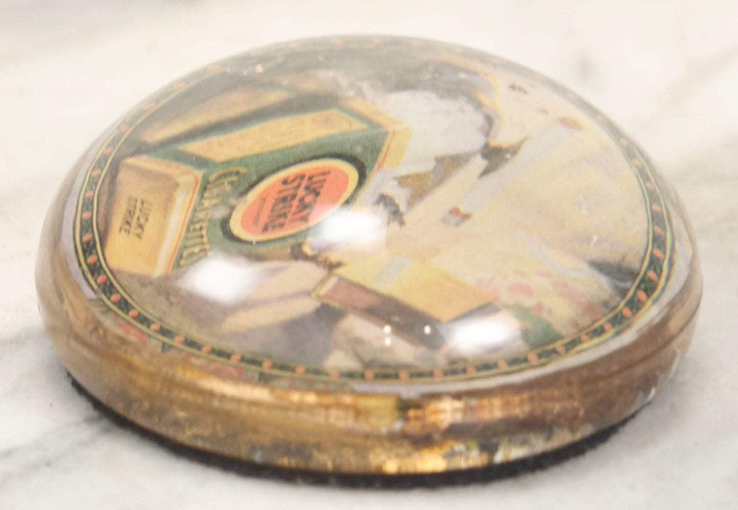 Lot 064 - Vintage Domed Glass Lucky Strike Cigarettes Advertising Paperweight With Box And Smoldering Cigarette In Ashtray