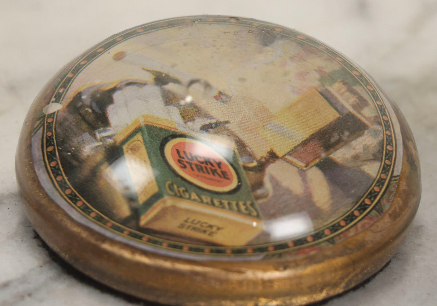 Lot 064 - Vintage Domed Glass Lucky Strike Cigarettes Advertising Paperweight With Box And Smoldering Cigarette In Ashtray