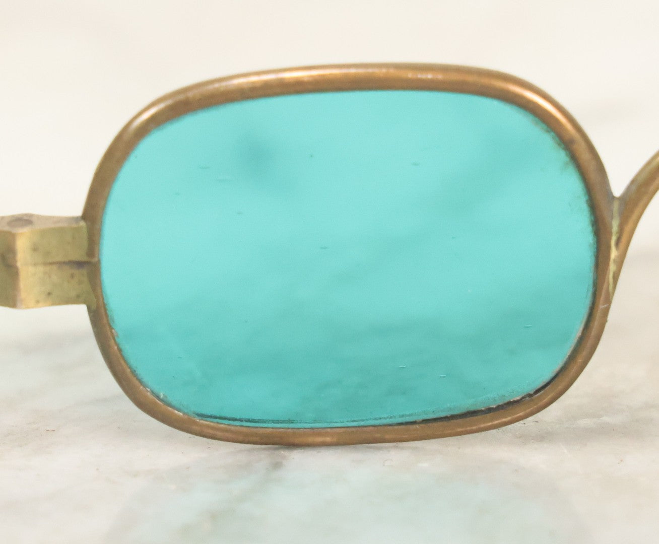 Lot 065 - Antique Brass Frame Eyeglasses With Blue-Green Tinted Lenses And Folding Side Extensions, In Black Lacquered Papier-Mâché Case With Gilt Detailing