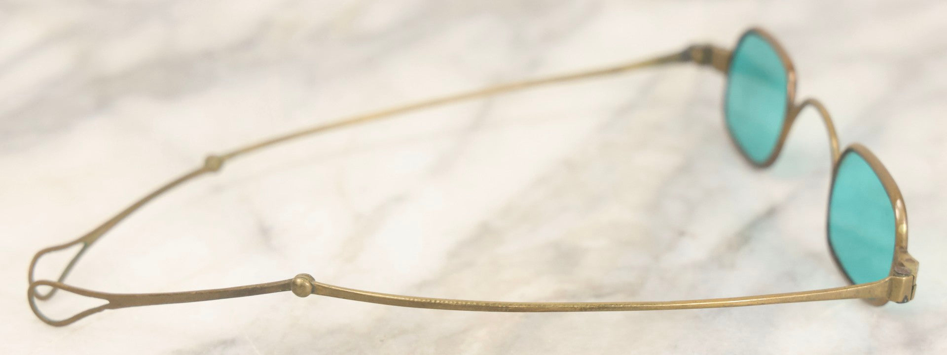 Lot 065 - Antique Brass Frame Eyeglasses With Blue-Green Tinted Lenses And Folding Side Extensions, In Black Lacquered Papier-Mâché Case With Gilt Detailing