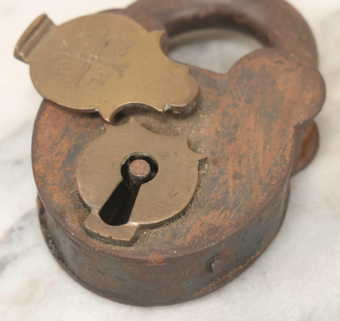Lot 072 - Antique Cast Iron And Brass Padlock Marked “B.M.Co.” With Cross Motif On Brass Cover, Unlocked, No Key