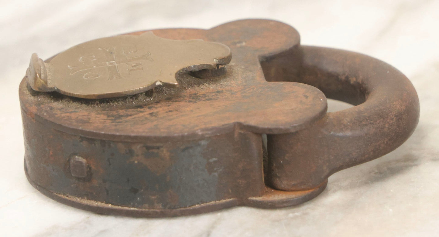 Lot 072 - Antique Cast Iron And Brass Padlock Marked “B.M.Co.” With Cross Motif On Brass Cover, Unlocked, No Key