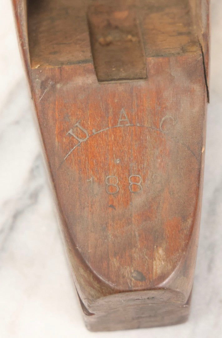 Lot 074 - Antique Handmade Coffin-Shaped Wood Plane With Engraved Pentagram Logo, Dated 1883, Marked U.A.C., Manufactured By A. Cumings, Boston, With Blade Present, 9-1/2" L
