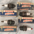 Lot 075 - Grouping Of Mixed Vintage Spark Plugs And Empty Dunlop Spark Plug Boxes Including Champion And Autolite Examples