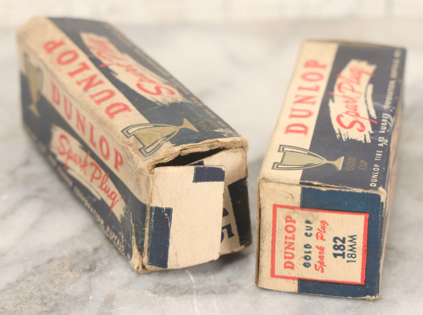 Lot 075 - Grouping Of Mixed Vintage Spark Plugs And Empty Dunlop Spark Plug Boxes Including Champion And Autolite Examples