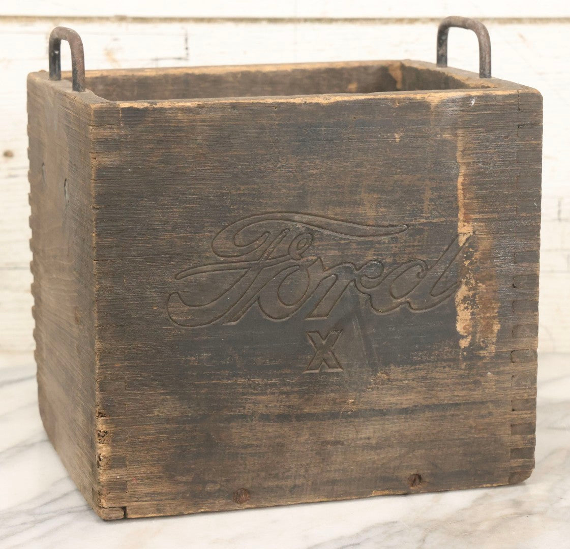 Lot 076 - Antique Finger-Jointed Wooden Box With Pressed Ford Logo And “X” Marking, Metal Side Handles, Possibly A Ford Motor Company Service Or Parts Box