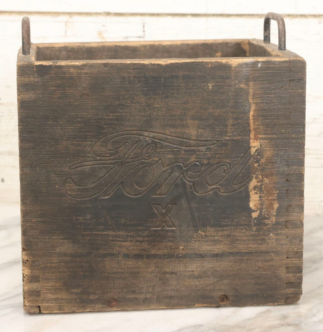 Lot 076 - Antique Finger-Jointed Wooden Box With Pressed Ford Logo And “X” Marking, Metal Side Handles, Possibly A Ford Motor Company Service Or Parts Box
