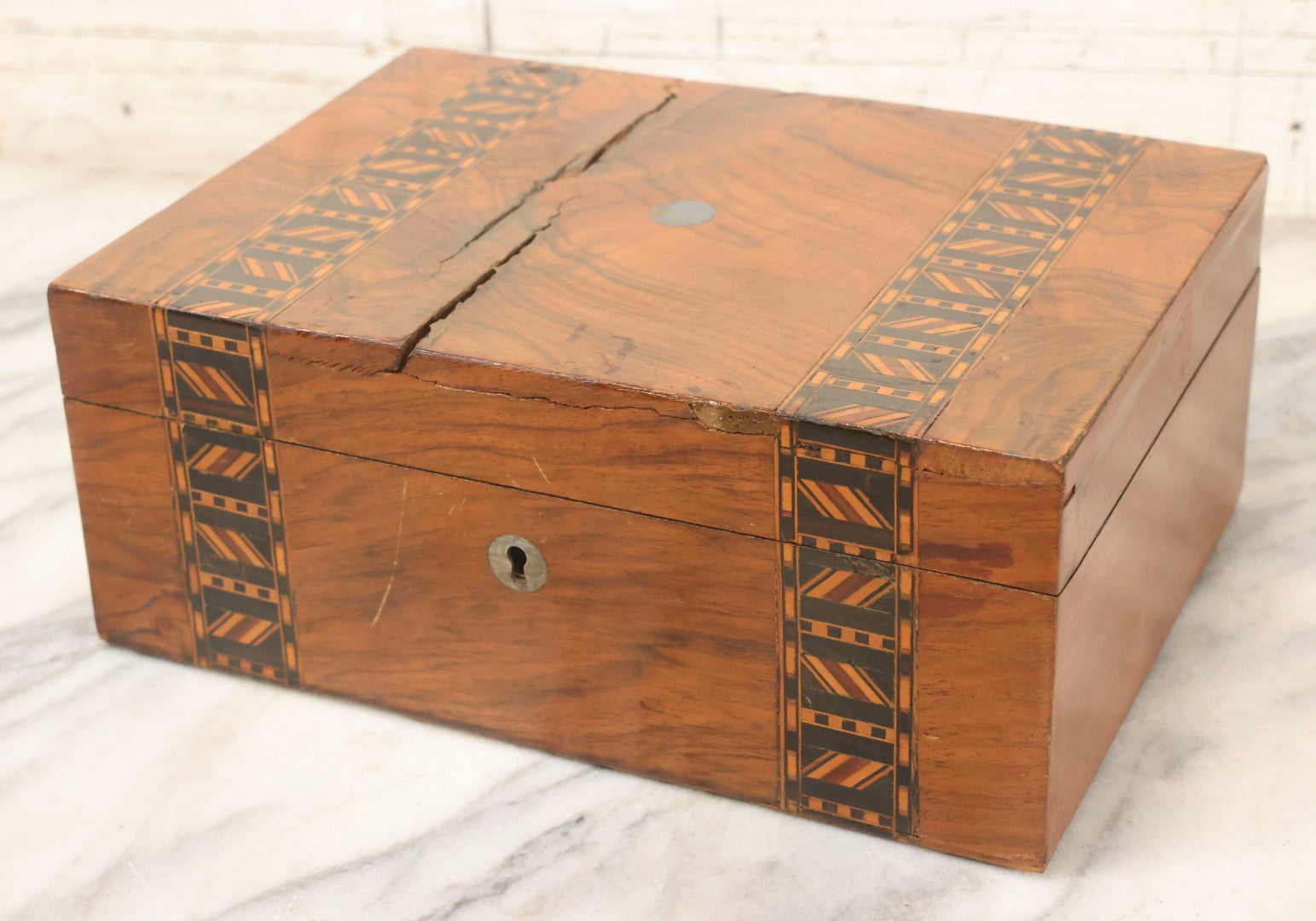 Lot 077 - Antique Burlwood Veneered Wooden Document Box With Inlaid Geometric Patterned Stripes And Center Metal Pendant