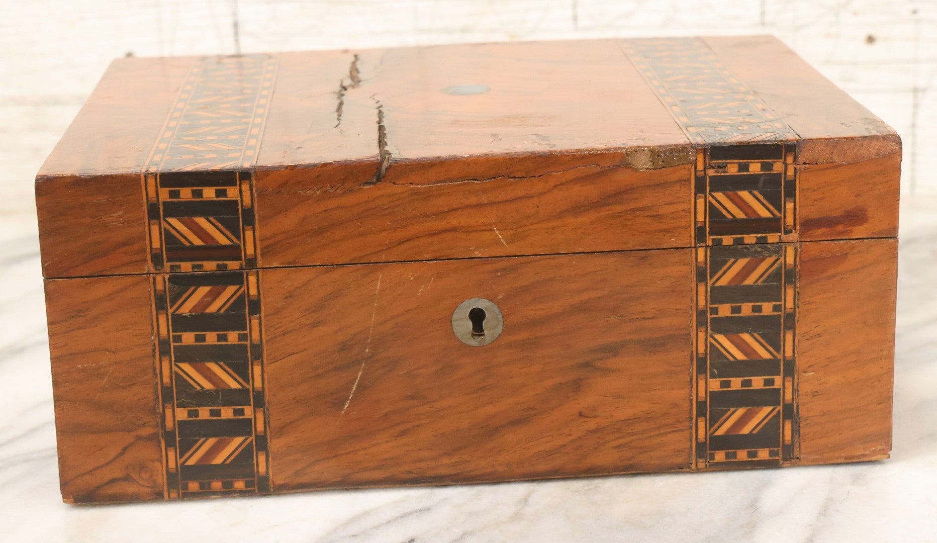Lot 077 - Antique Burlwood Veneered Wooden Document Box With Inlaid Geometric Patterned Stripes And Center Metal Pendant