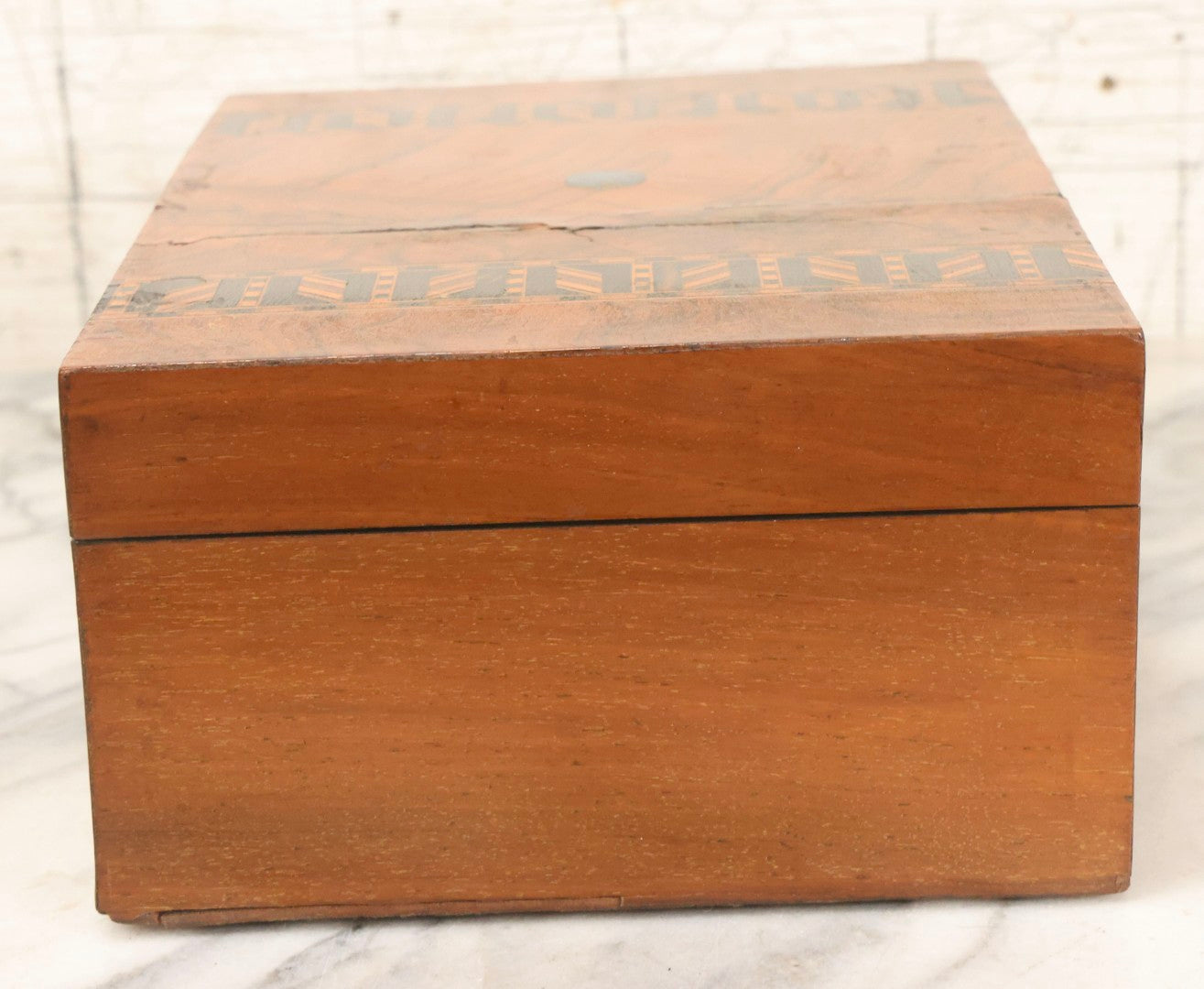 Lot 077 - Antique Burlwood Veneered Wooden Document Box With Inlaid Geometric Patterned Stripes And Center Metal Pendant