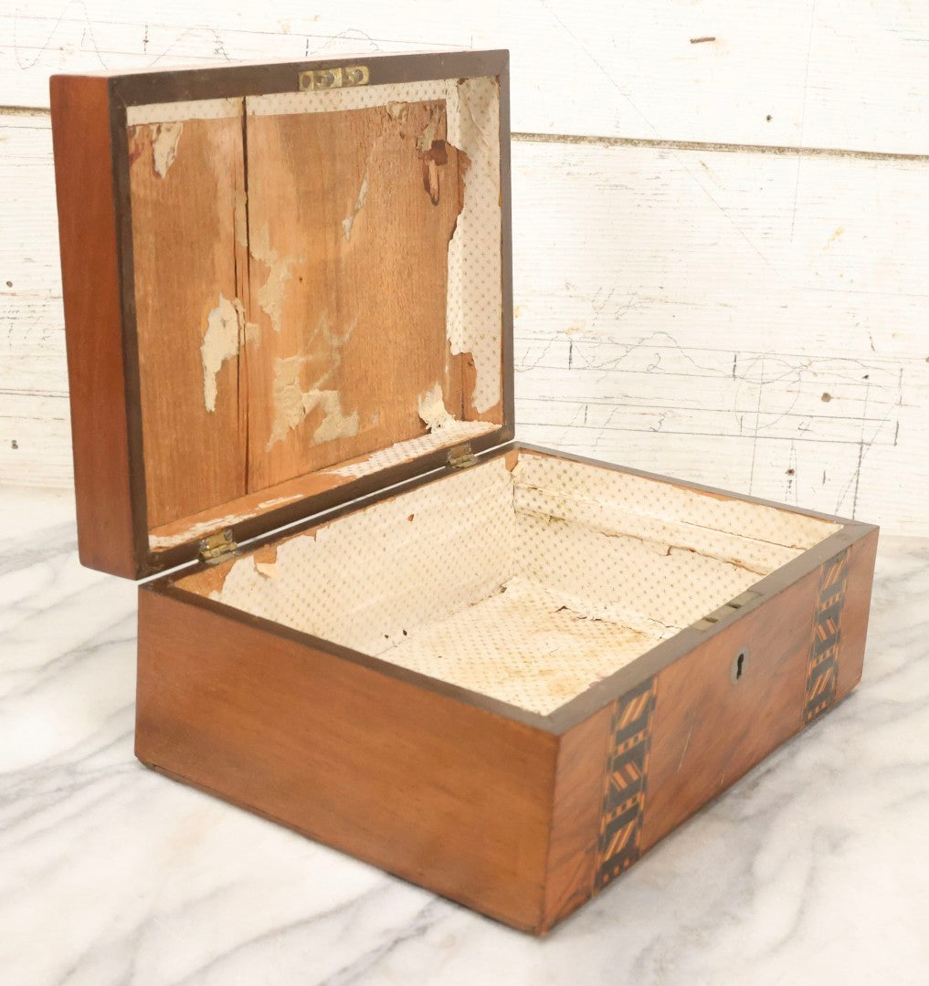 Lot 077 - Antique Burlwood Veneered Wooden Document Box With Inlaid Geometric Patterned Stripes And Center Metal Pendant