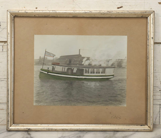 Lot 156 - Vintage Hand-Colored Boarded Photograph Of Steamboat “Coquet” Passing Algoma Street Bridge And Lumber Mill, Oshkosh, Wisconsin, Early 20th Century, Framed, 14-3/8" x 11-7/8"