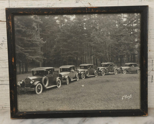 Lot 157 - Antique Photograph Of Early Automobiles Carrying “National Register” Crates, Signed Clark, Framed By Geo. E. Chalmers Co., Rutland, Vermont, Framed, 10" x 8"
