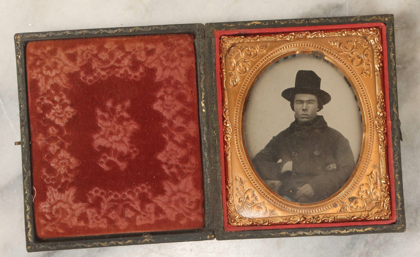Lot 162 - Antique 1/6th Plate Ambrotype Photograph Of Stern Young Man In Wide-Brimmed Hat And Peacoat With Hand In Jacket, In Leatherette Union Case