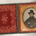 Lot 162 - Antique 1/6th Plate Ambrotype Photograph Of Stern Young Man In Wide-Brimmed Hat And Peacoat With Hand In Jacket, In Leatherette Union Case