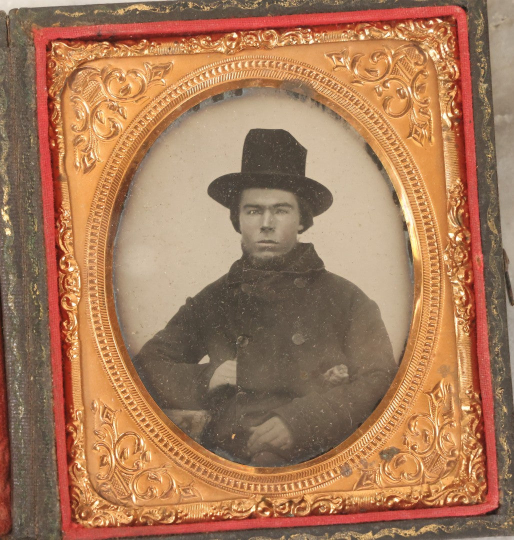 Lot 162 - Antique 1/6th Plate Ambrotype Photograph Of Stern Young Man In Wide-Brimmed Hat And Peacoat With Hand In Jacket, In Leatherette Union Case