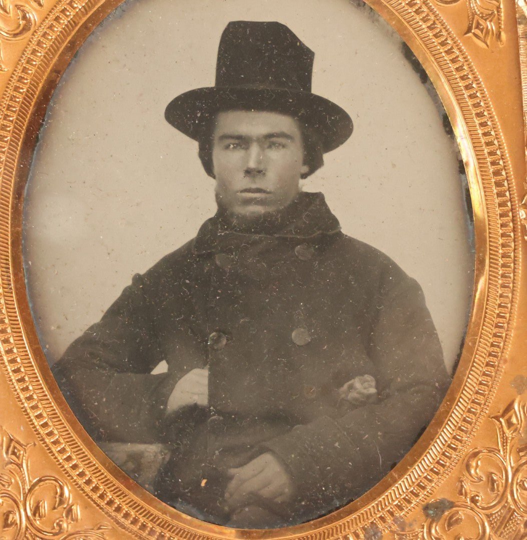 Lot 162 - Antique 1/6th Plate Ambrotype Photograph Of Stern Young Man In Wide-Brimmed Hat And Peacoat With Hand In Jacket, In Leatherette Union Case