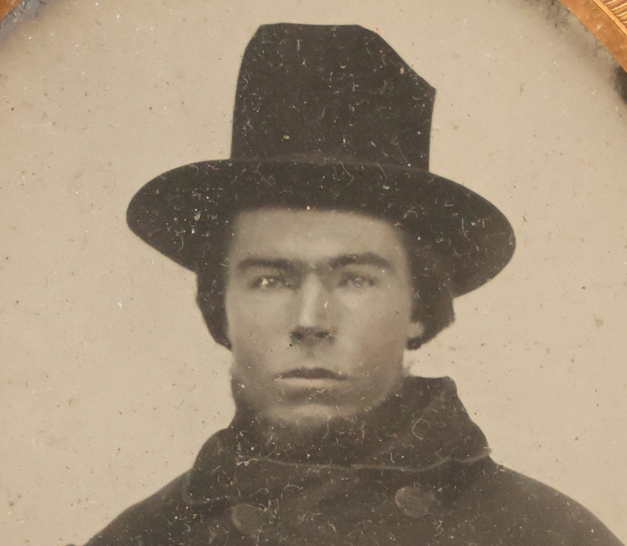 Lot 162 - Antique 1/6th Plate Ambrotype Photograph Of Stern Young Man In Wide-Brimmed Hat And Peacoat With Hand In Jacket, In Leatherette Union Case