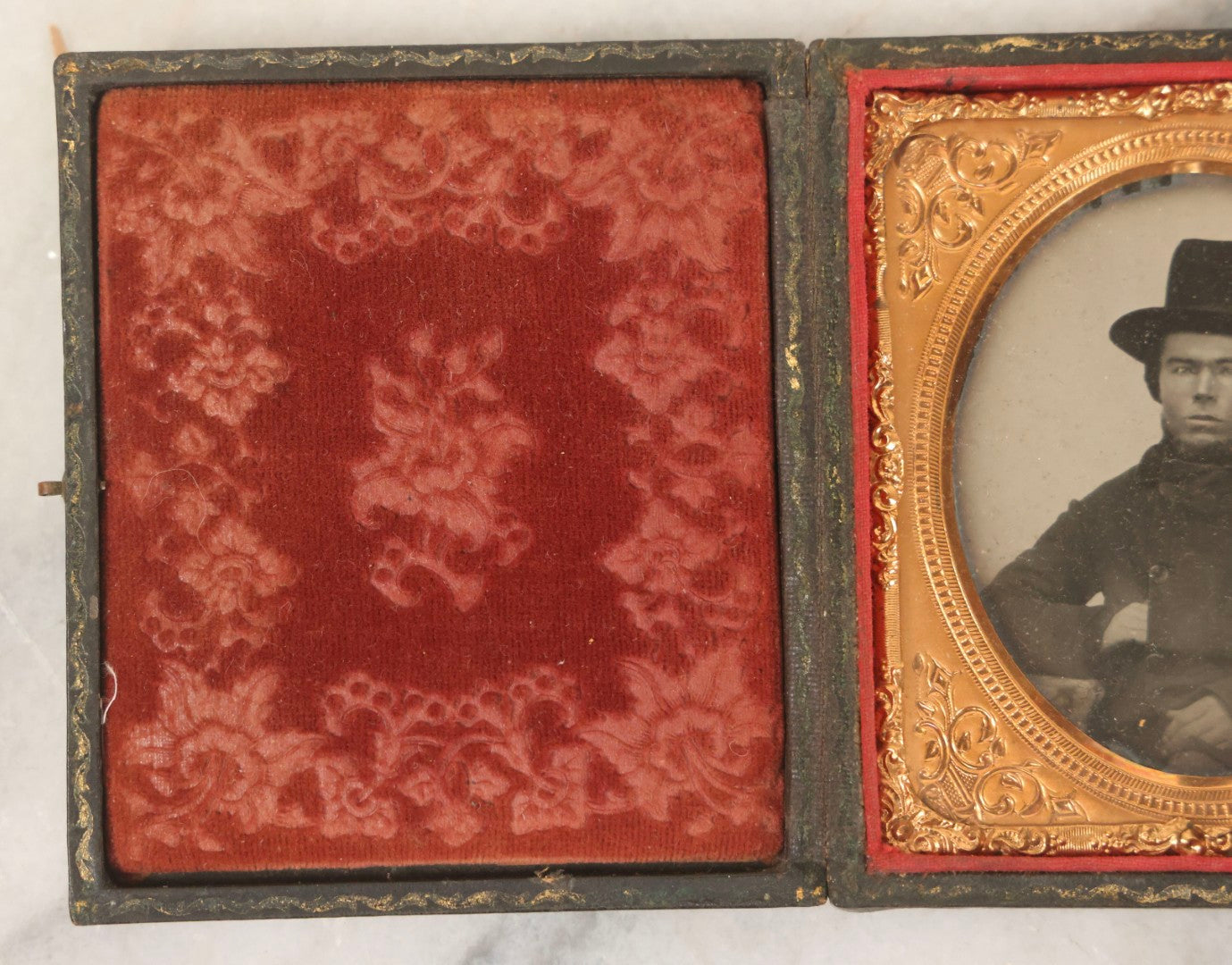 Lot 162 - Antique 1/6th Plate Ambrotype Photograph Of Stern Young Man In Wide-Brimmed Hat And Peacoat With Hand In Jacket, In Leatherette Union Case