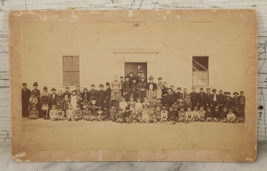 Lot 168 - Antique Boarded Photograph Of Large School Class With Teachers Before Schoolhouse, Numbered And Annotated On Verso