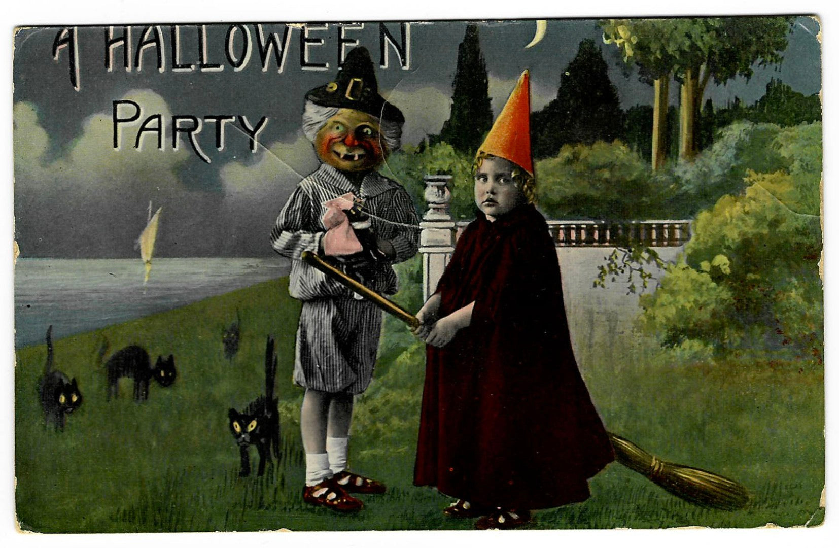 Lot 195 - Antique Hallowe'en Postcard “A Hallowe'en Party” Depicting Child In Cone Hat And Jack-O-Lantern Masked Figure With Cats, Moonlit Garden Scene, Series 1312, Made In Germany, Postmarked Amsterdam, Netherlands, 1921, Written On Verso