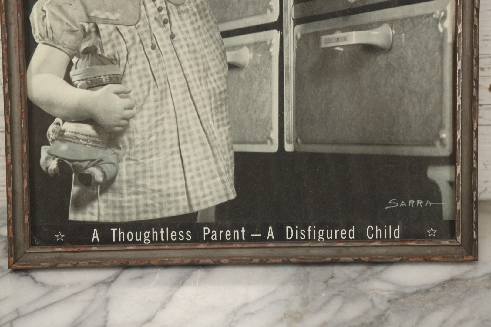 Lot 234 - Vintage Safety Photograph “A Thoughtless Parent—A Disfigured Child,” Signed Sarra, In Gray Painted Frame, 11-1/8" x 12-1/8"