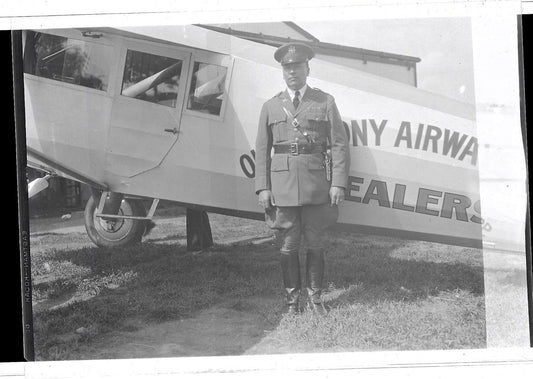 Lot 257 - Grouping Of Three Pieces Of Vintage Aviation Ephemera Including North American Aviation Employee Id Badge For John C. Behan And Two Celluloid Negatives Depicting "Old Colony Airways Corp Dealers" Aircraft And Pilot