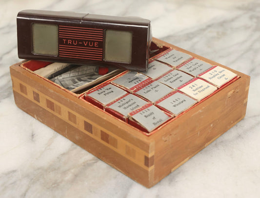 Lot 263 - Vintage Tru-Vue Bakelite Stereoscope Stereoviewer With 12 Film Strips Including Ringling Bros., New York World's Fair, And More, In Fitted Inlaid Wooden Box With Instructions, Manufactured By Tru-Vue Inc., Rock Island, Illinois