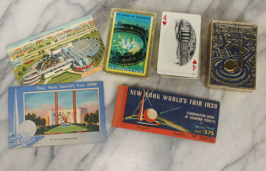 Lot 266 - Grouping Of Three Vintage New York World's Fair 1939 Souvenirs Including Used Ticket Book, Complete Deck Of Playing Cards In Gold Foil Box, Ford Motor Company Building Postcard, And Hall Of Communications Postcard