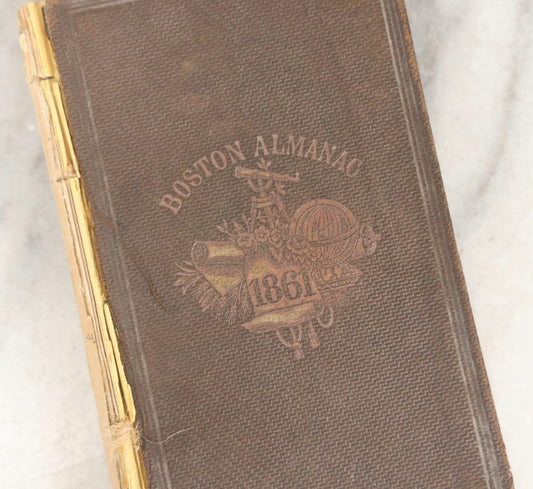 Lot 276 - "Boston Almanac 1861" Antique Illustrated Almanac Published In Boston, 1861, With Gilt Cover Design And Handwritten Monthly Memoranda, Note Poor Condition, Detached Covers