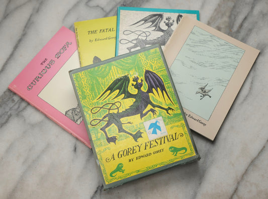 Lot 310 - "A Gorey Festival" Vintage Illustrated Four-Book Box Set By Edward Gorey, Including "The Fatal Lozenge," "The Curious Sofa," "The Sinking Spell," And "The Hapless Child," Published By Aster Honor Inc. And Ivan Obolensky, New York, 1960–1969