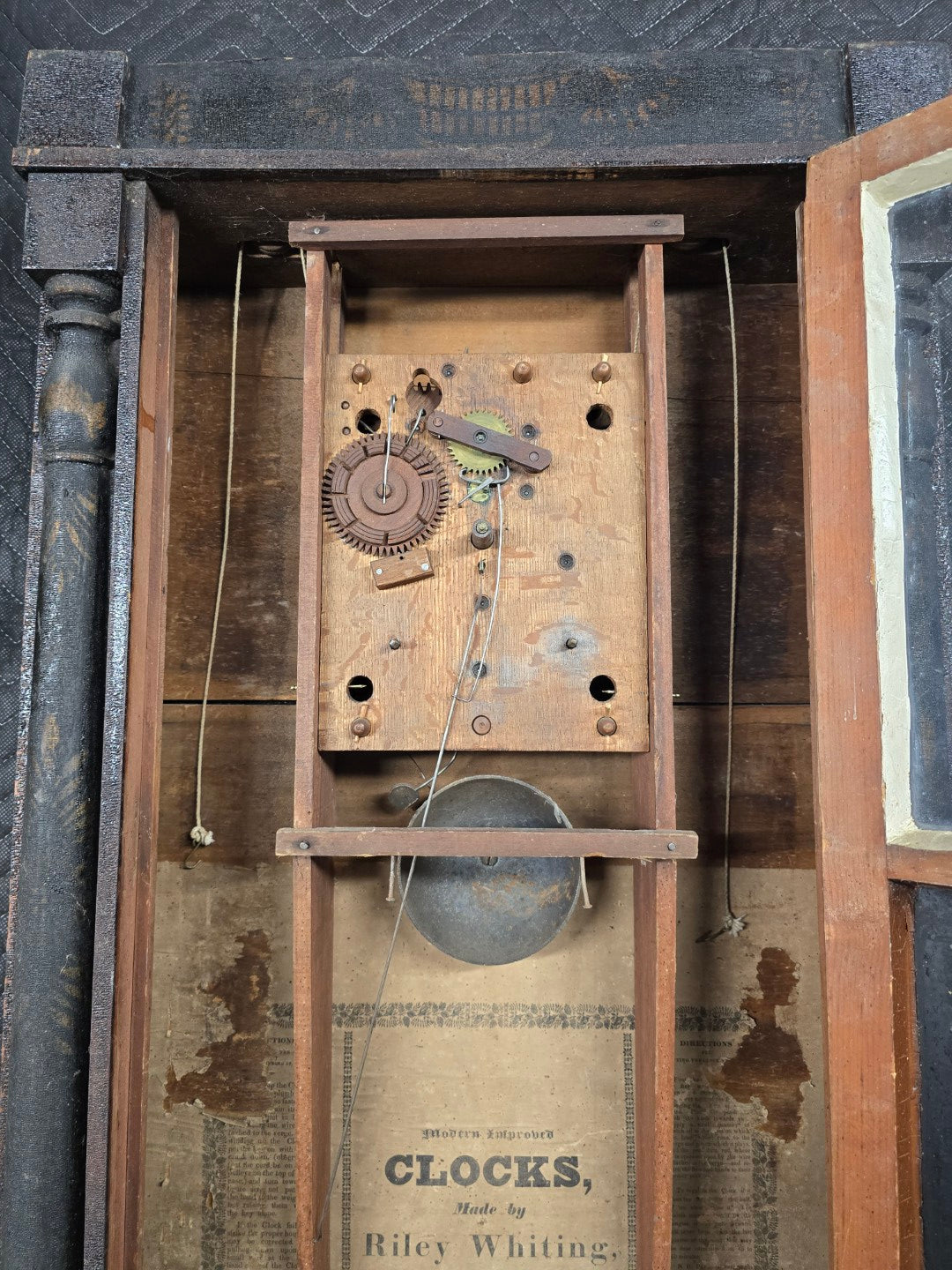 Lot 004 - Antique Column And Splat Shelf Clock By Riley Whiting, Winchester, Connecticut, With 30-Hour Wooden Works And Reverse Painted Door With “The Orphan's Prayer” Scene, Child Praying At Monument, Includes Weights, Pendulum, And Key