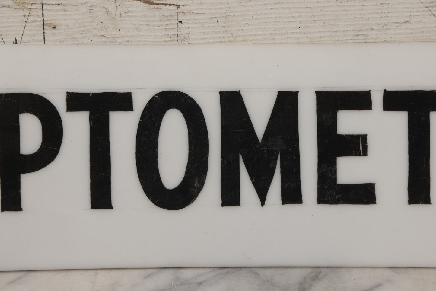 Lot 011 - Vintage Hand-Painted "Optometrist" Trade Sign On White Plexiglass, 23-1/2" x 6"