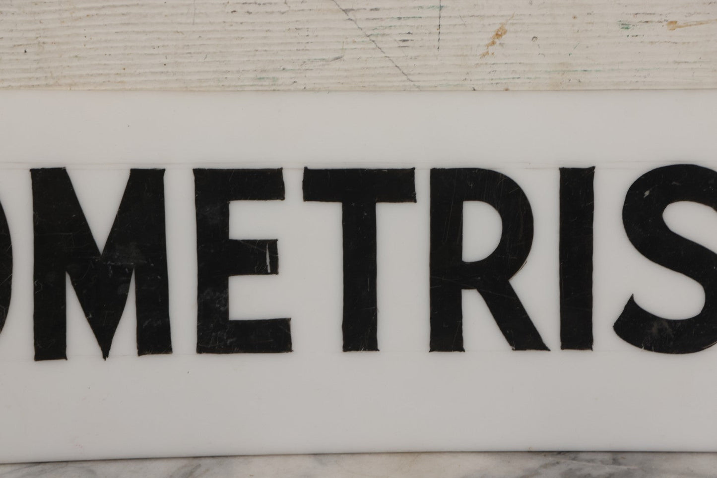 Lot 011 - Vintage Hand-Painted "Optometrist" Trade Sign On White Plexiglass, 23-1/2" x 6"